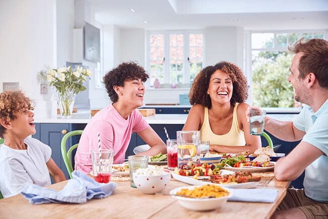Family having dinner conversation
